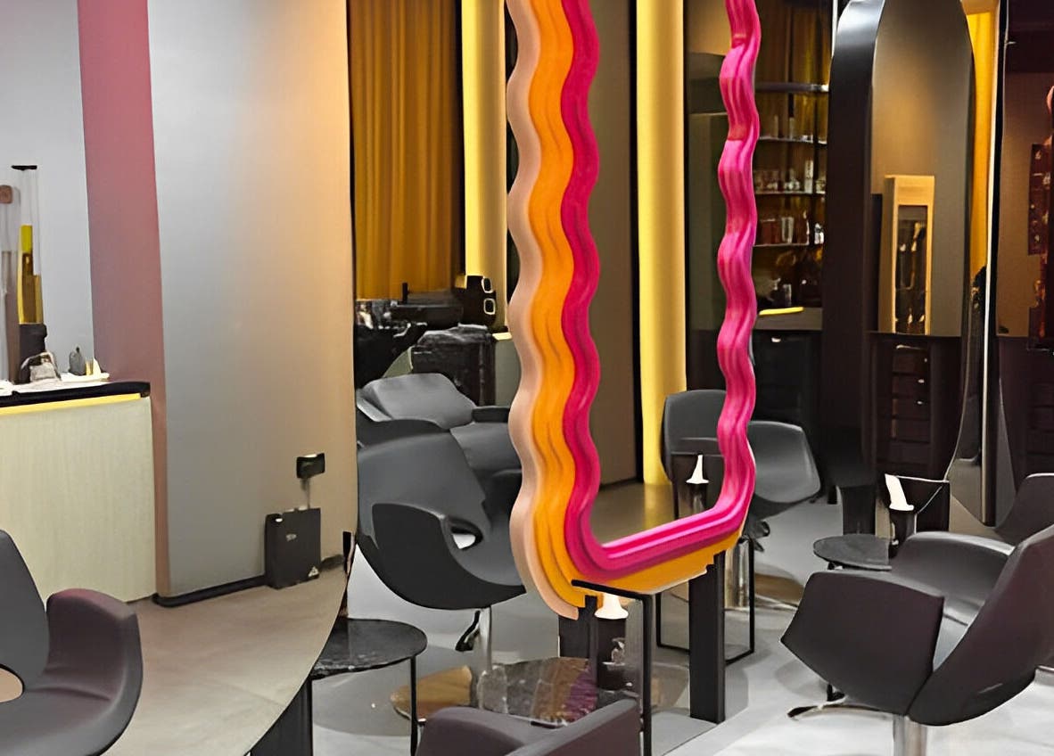 Modern salon interior at 360 Beauty Lounge, Sharjah, Sharjah, AE with chic chairs and colorful decor.