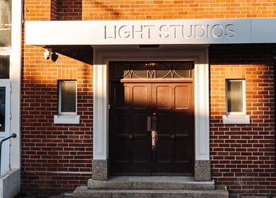 Front entrance of Ruby's Refuge at Light Studios, Plymouth, England, GB, showcasing a sleek modern design.