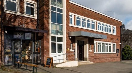 Exterior of Ruby's Refuge at Light Studios in Plymouth, England, showcasing its welcoming brick facade.
