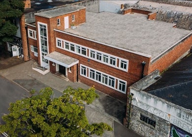 Ruby's Refuge at Light Studios, red brick building in Plymouth, England, GB, aerial view.