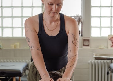 Massage therapist at Ruby's Refuge at Light Studios in Plymouth, England, GB providing relaxing therapy.
