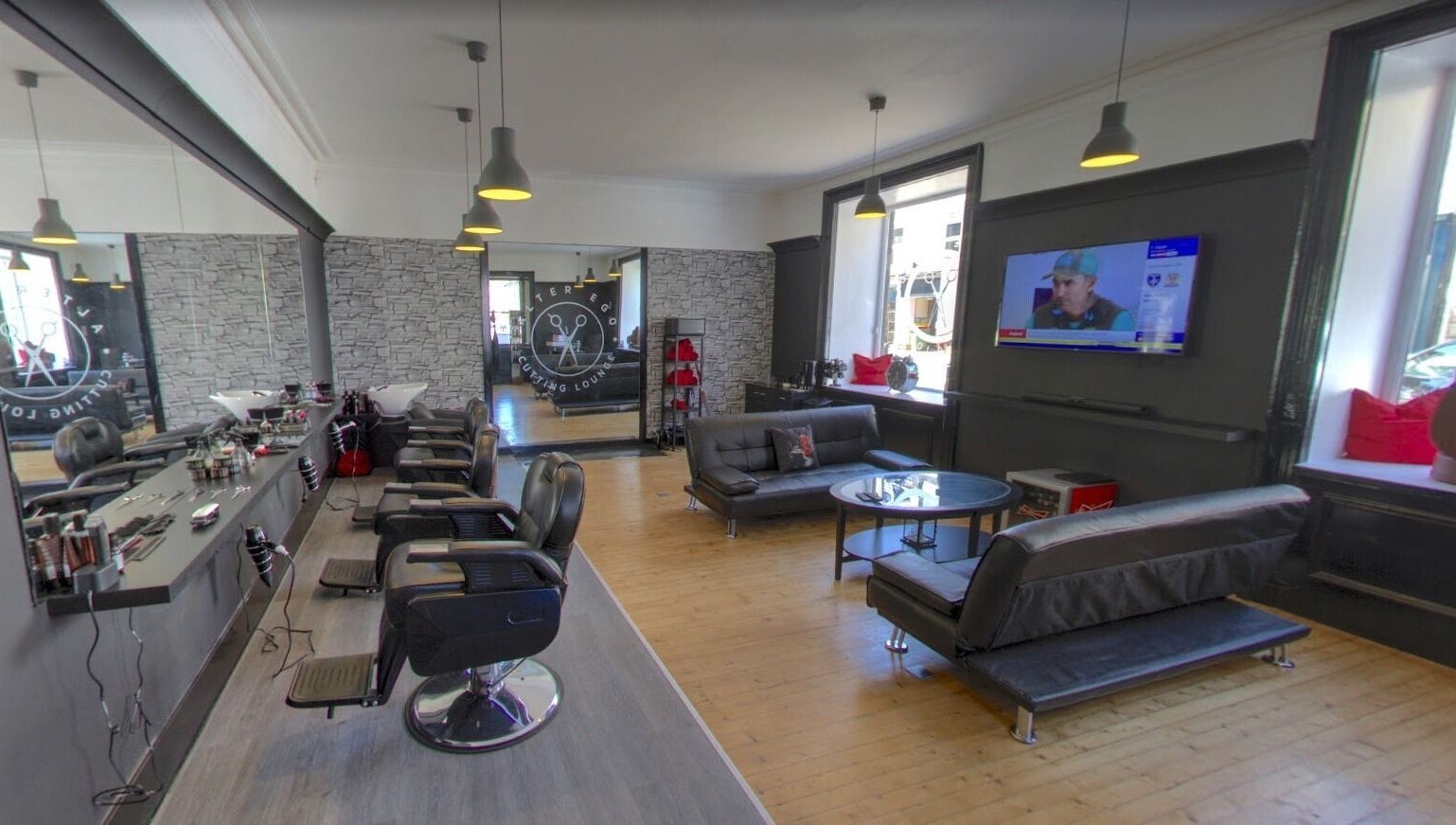 Spacious and modern interior of Alter Ego in Ayr, Scotland, GB featuring stylish salon and lounge area.
