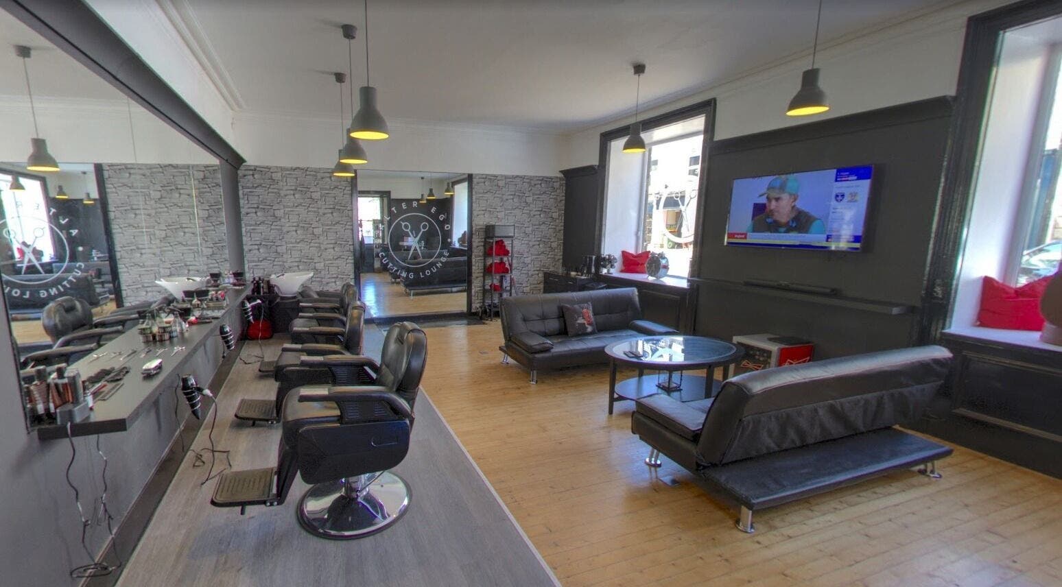 Spacious and modern interior of Alter Ego in Ayr, Scotland, GB featuring stylish salon and lounge area.