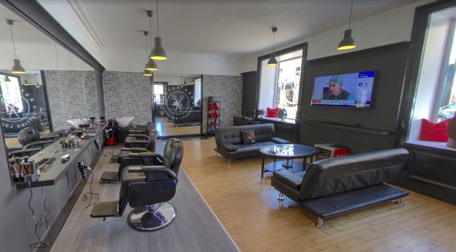Spacious and modern interior of Alter Ego in Ayr, Scotland, GB featuring stylish salon and lounge area.