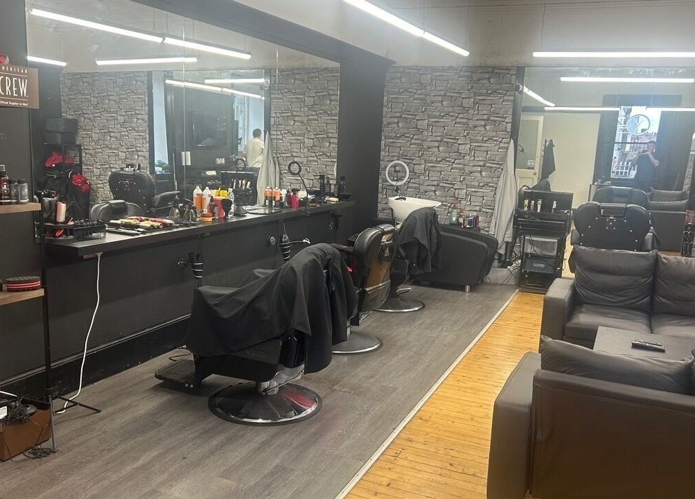 Chic salon interior at Alter Ego, Ayr, Scotland, GB featuring modern chairs and stylish decor.