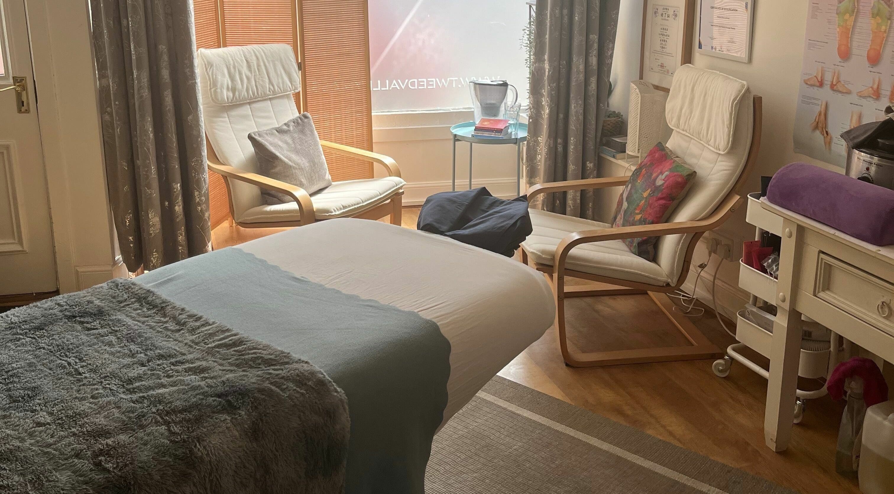 Cozy massage room at Tweed Valley Massage, Innerleithen, Scotland, GB with a treatment bed and soft lighting.