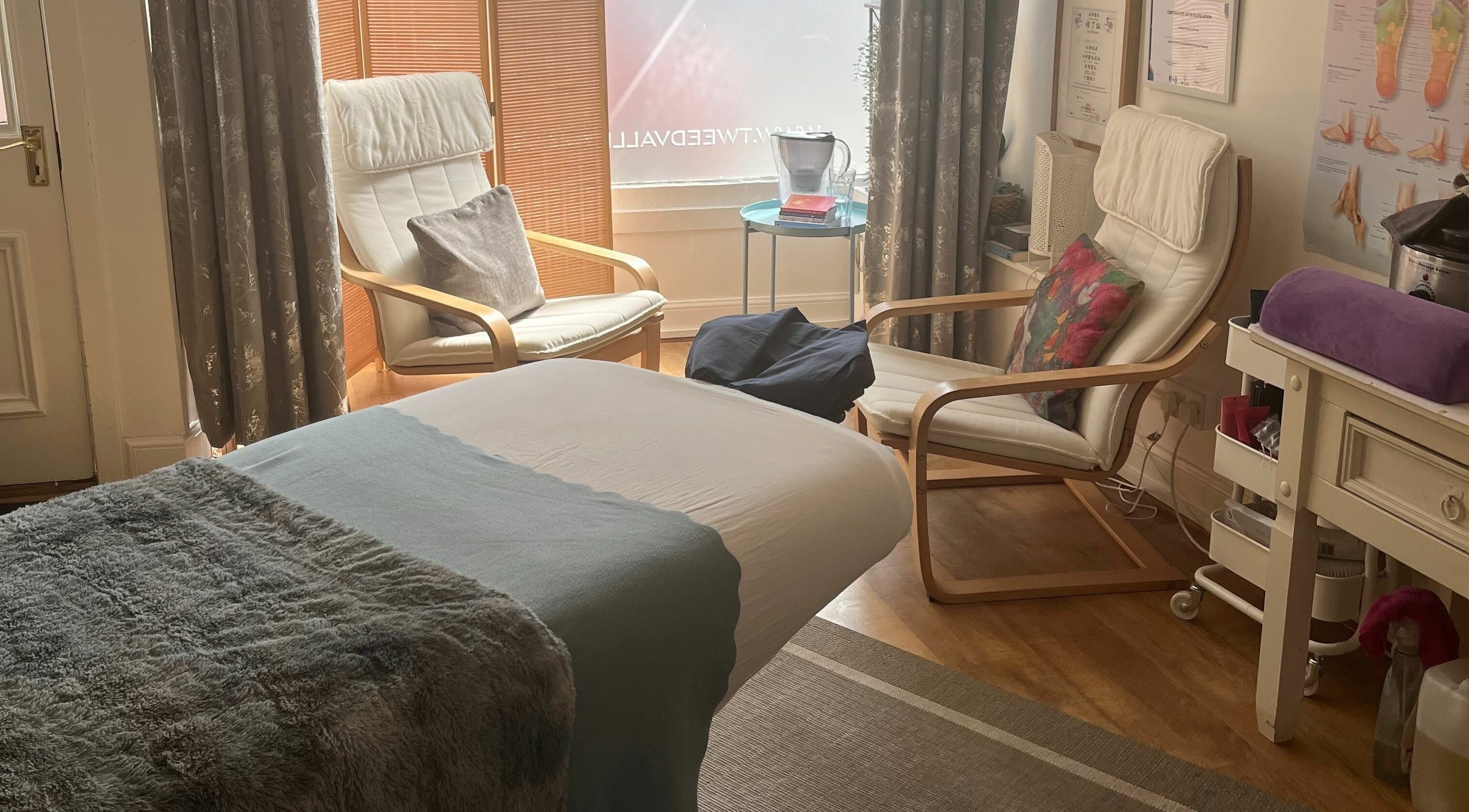 Cozy massage room at Tweed Valley Massage, Innerleithen, Scotland, GB with a treatment bed and soft lighting.