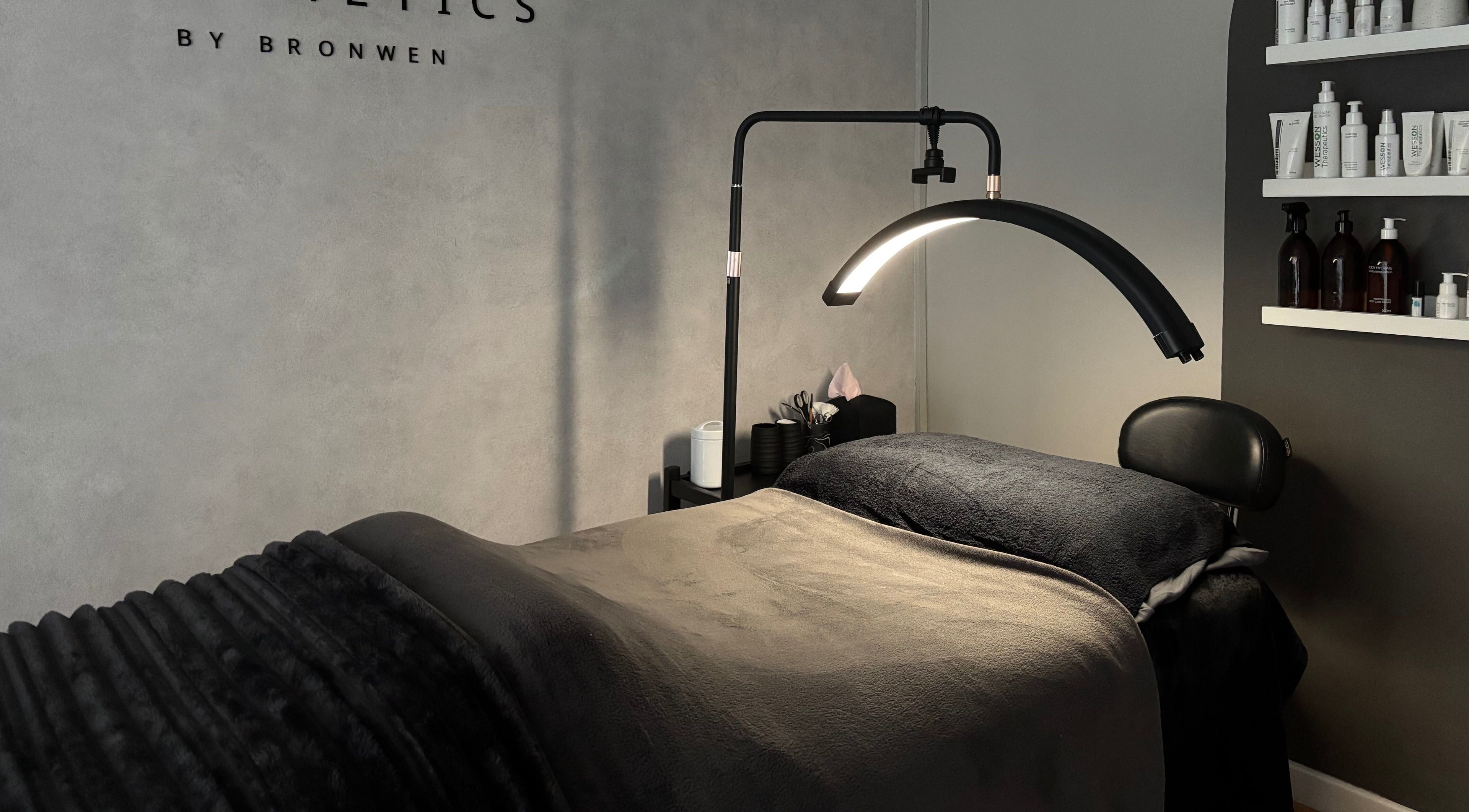 Luxury spa room at Aesthetics By Bronwen in Cape Town, Western Cape, ZA, featuring cozy massage bed.