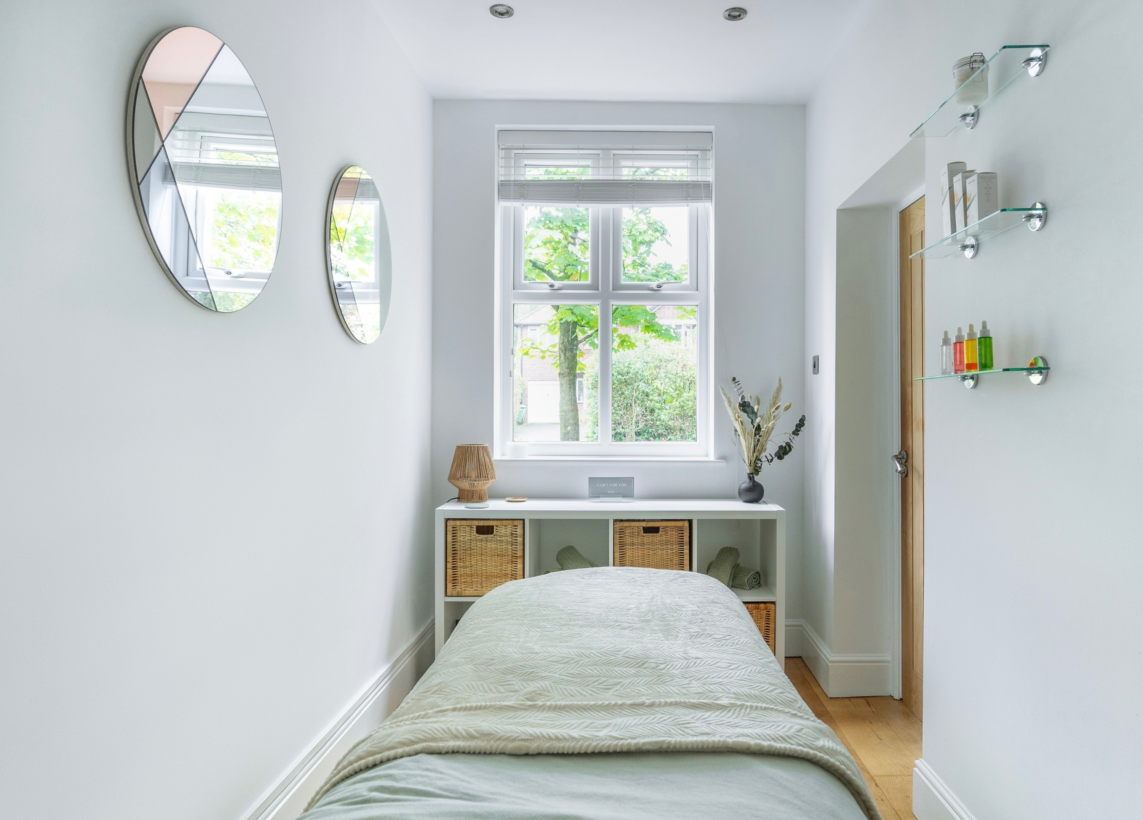 Tranquil massage room at Sage Massage, Wilmslow, England, with serene decor and natural light.