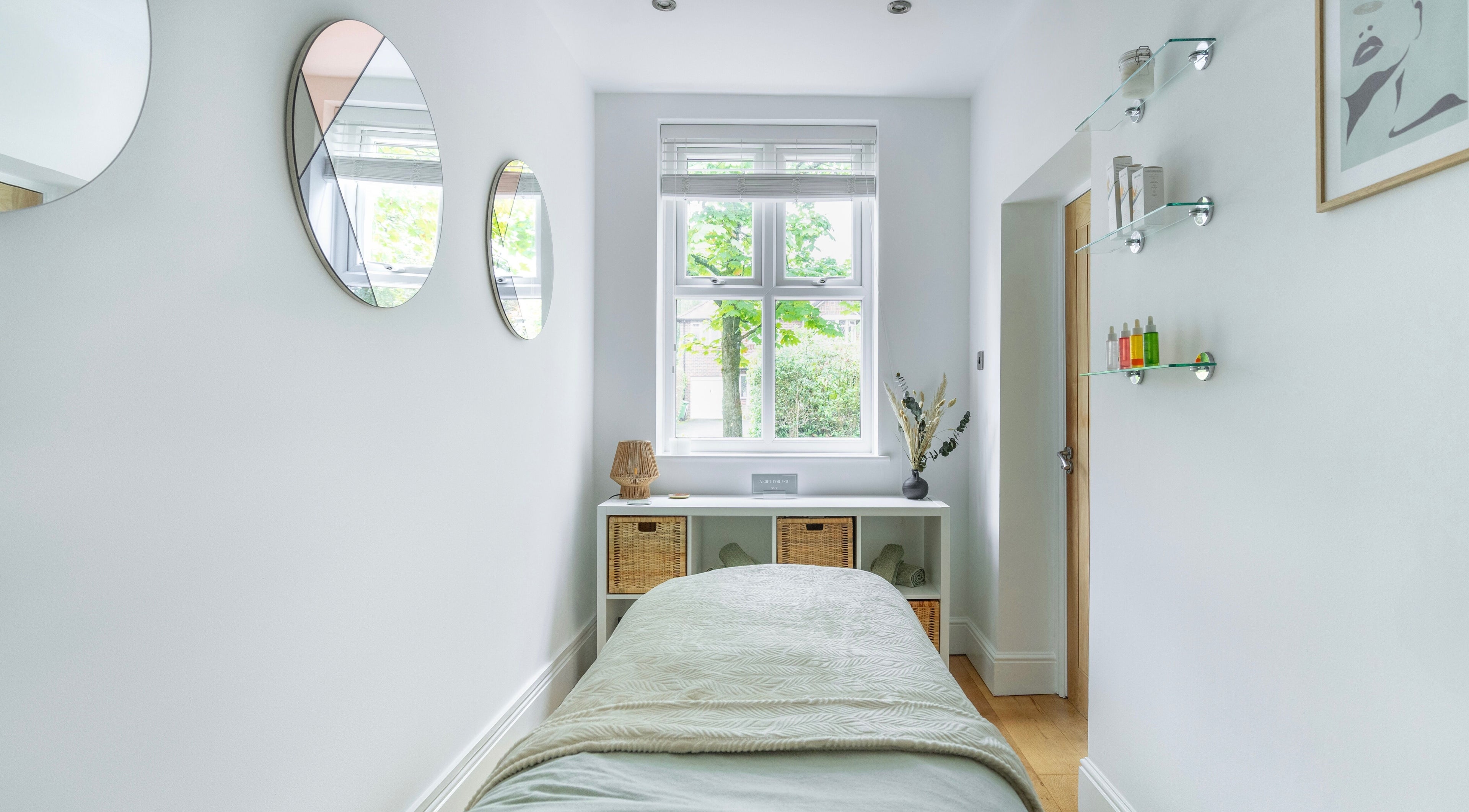 Tranquil massage room at Sage Massage, Wilmslow, England, with serene decor and natural light.