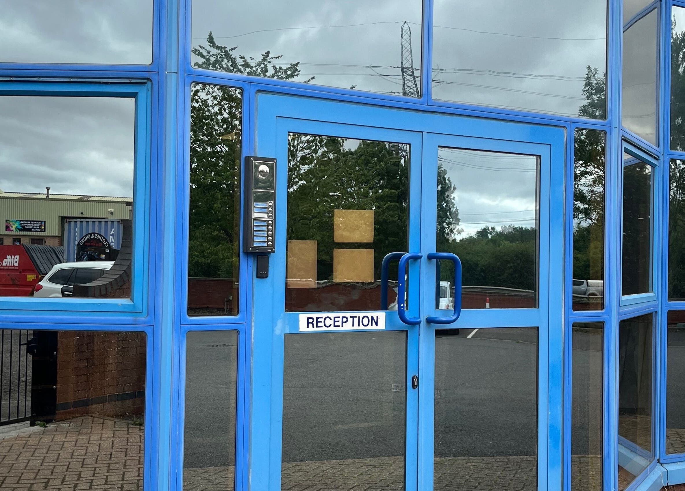 Entrance of The Wax Edit - Beauty by SM with blue glass doors in Eaton Socon, England, GB.