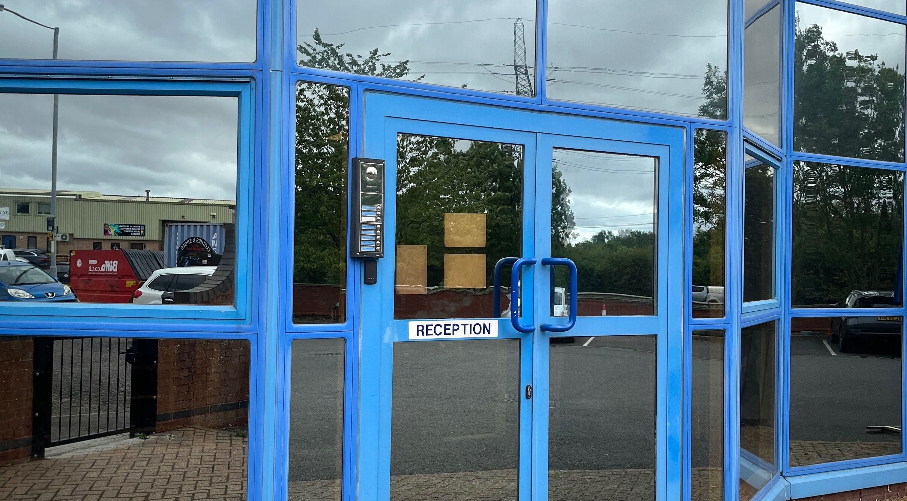 Entrance of The Wax Edit - Beauty by SM with blue glass doors in Eaton Socon, England, GB.
