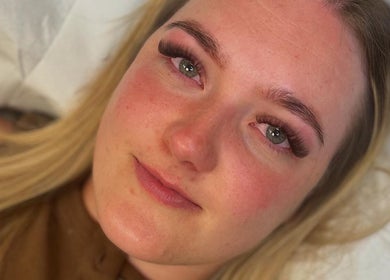 Close-up of a smiling customer with vibrant lashes at Lashes by Georgia, Stoke-on-Trent, England, GB.