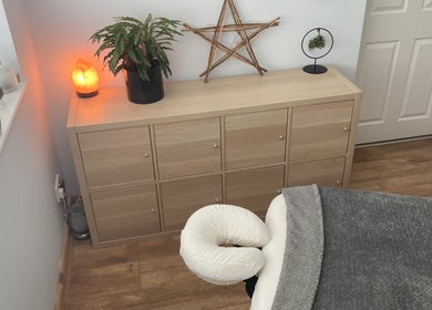 Relaxing massage room at Waseley Wellbeing, Worcestershire, GB with plants and salt lamp.