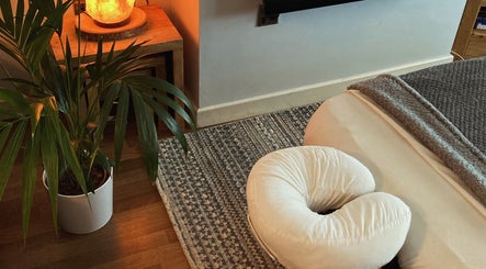 A tranquil treatment room at Waseley Wellbeing, Worcestershire, GB with a massage bed and calming ambiance.