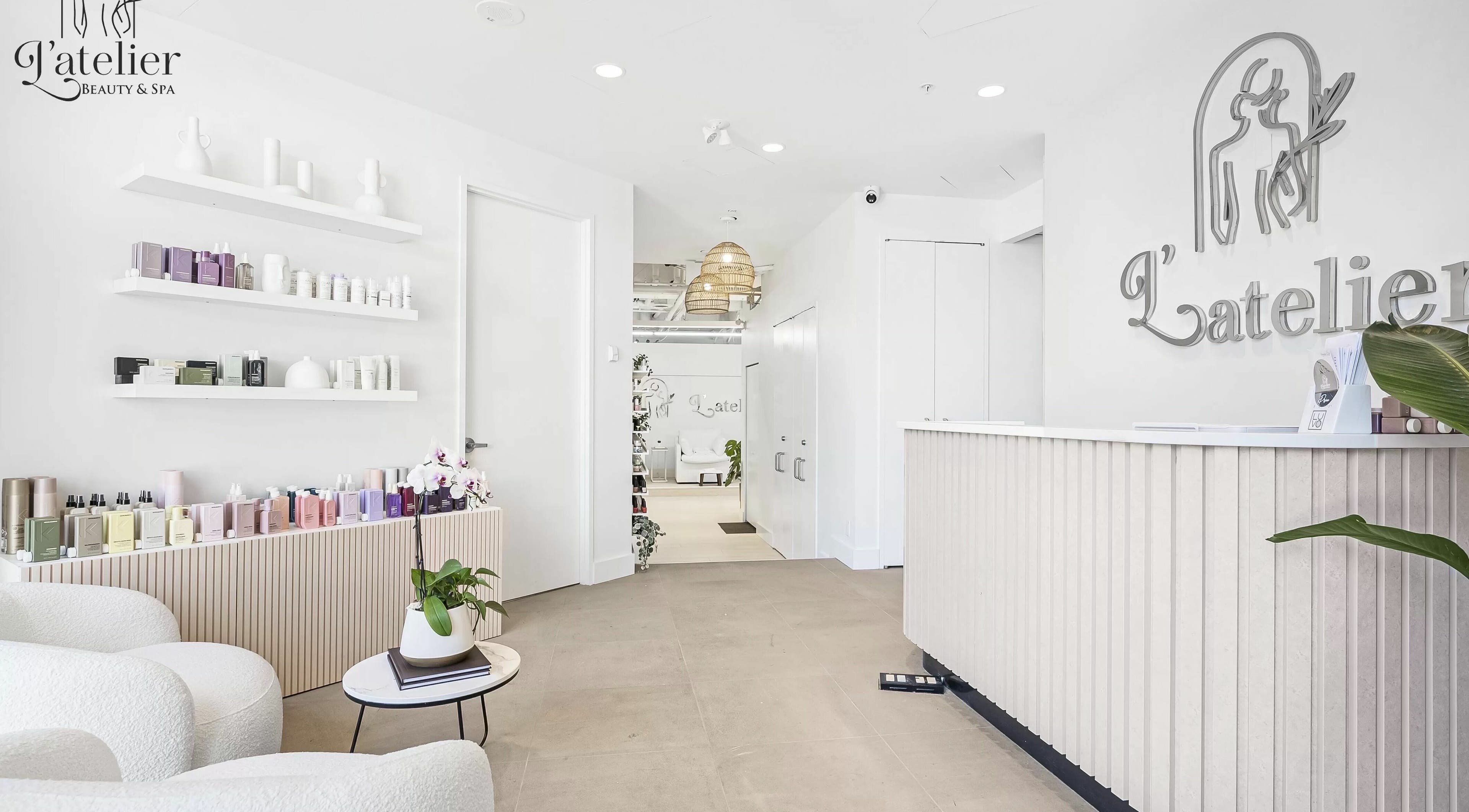 Elegant reception area of L’atelier Beauty and Spa in Vancouver, British Columbia, CA with modern decor.