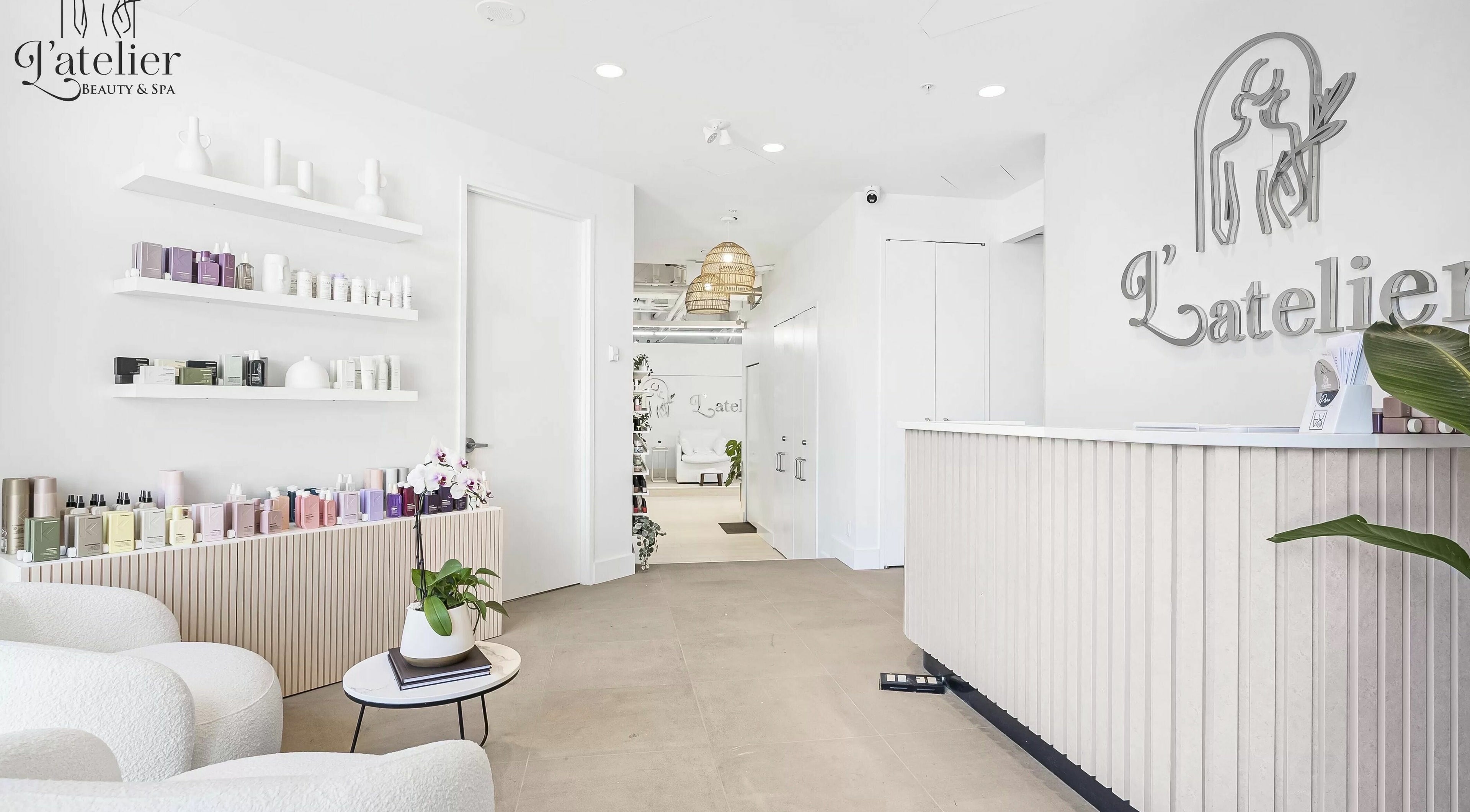 Elegant reception area of L’atelier Beauty and Spa in Vancouver, British Columbia, CA with modern decor.