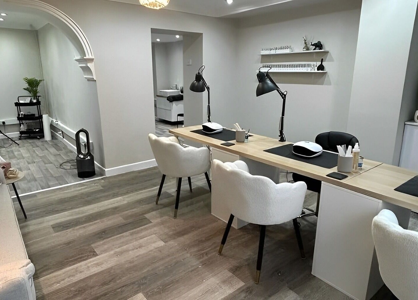 Modern nail care station at Ekb Studio, Lydney, England, GB. Features chic decor and ample seating.