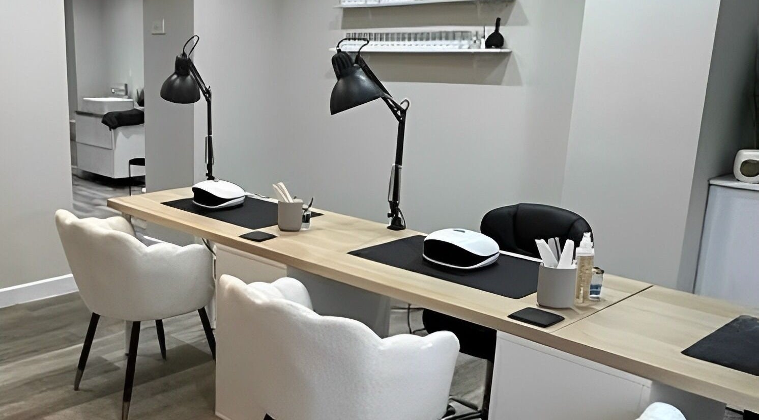 Modern nail service area at Ekb Studio, Lydney, England, GB. Elegant chairs and tools set up for client treatments.