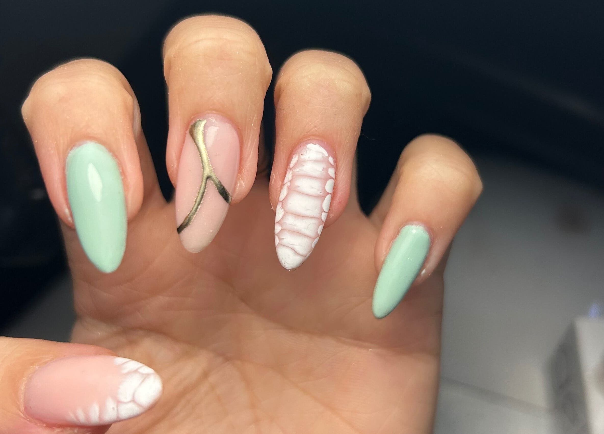 Intricate nail art manicure at Ekb Studio, Lydney, England, GB, showcasing pastel and abstract designs.