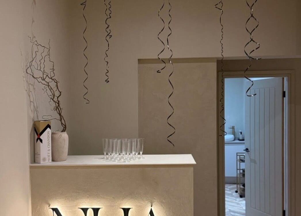 Chic decor with champagne box and glasses at TATTOOBAE, Bury, England, GB. Perfect for beauty and wellness ambience.