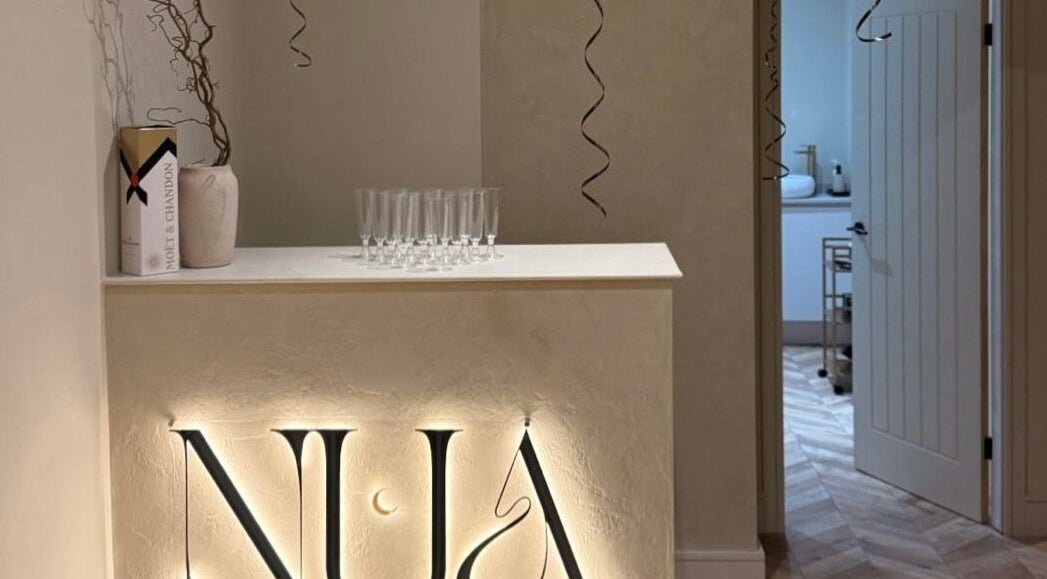 Elegant reception area at TATTOOBAE, Bury, England, GB with stylish decor and sophisticated ambiance.