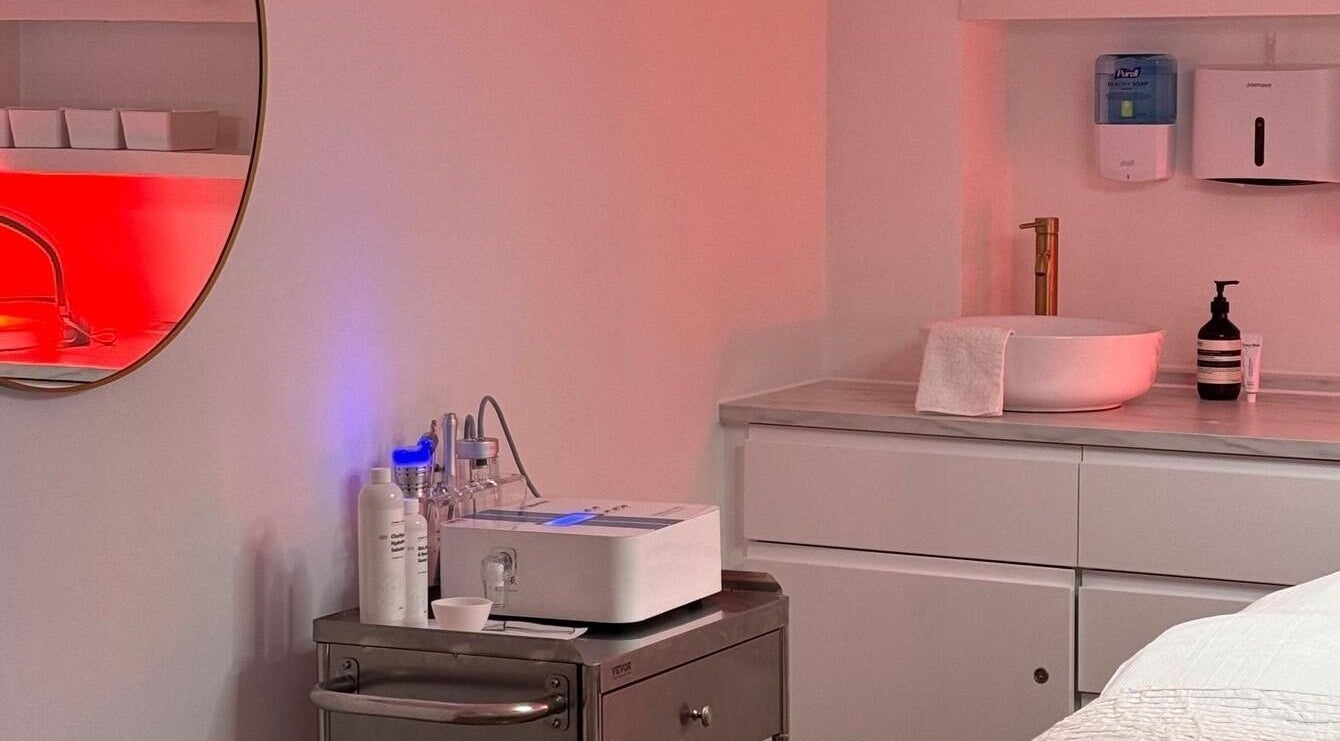 Serene spa corner at Skinrise, London, England, GB. Features sink, towels, and wellness equipment.