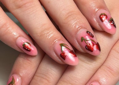 Strawberry nail art at House of Glam, Newcastle upon Tyne, England, GB showcasing intricate red designs.
