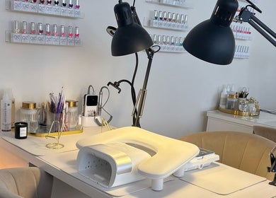 Elegant nail station at House of Glam, Newcastle upon Tyne, England, GB, featuring gel polishes and tools.