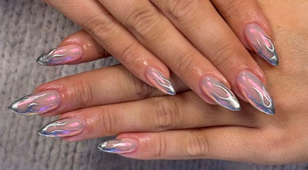 Stylish nail art design at House of Glam, Newcastle upon Tyne, England, GB showcasing dazzling silver flames.
