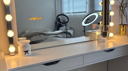 Vanity with lights at House of Glam, Newcastle upon Tyne, England, GB. Reflects modern beauty salon setup.