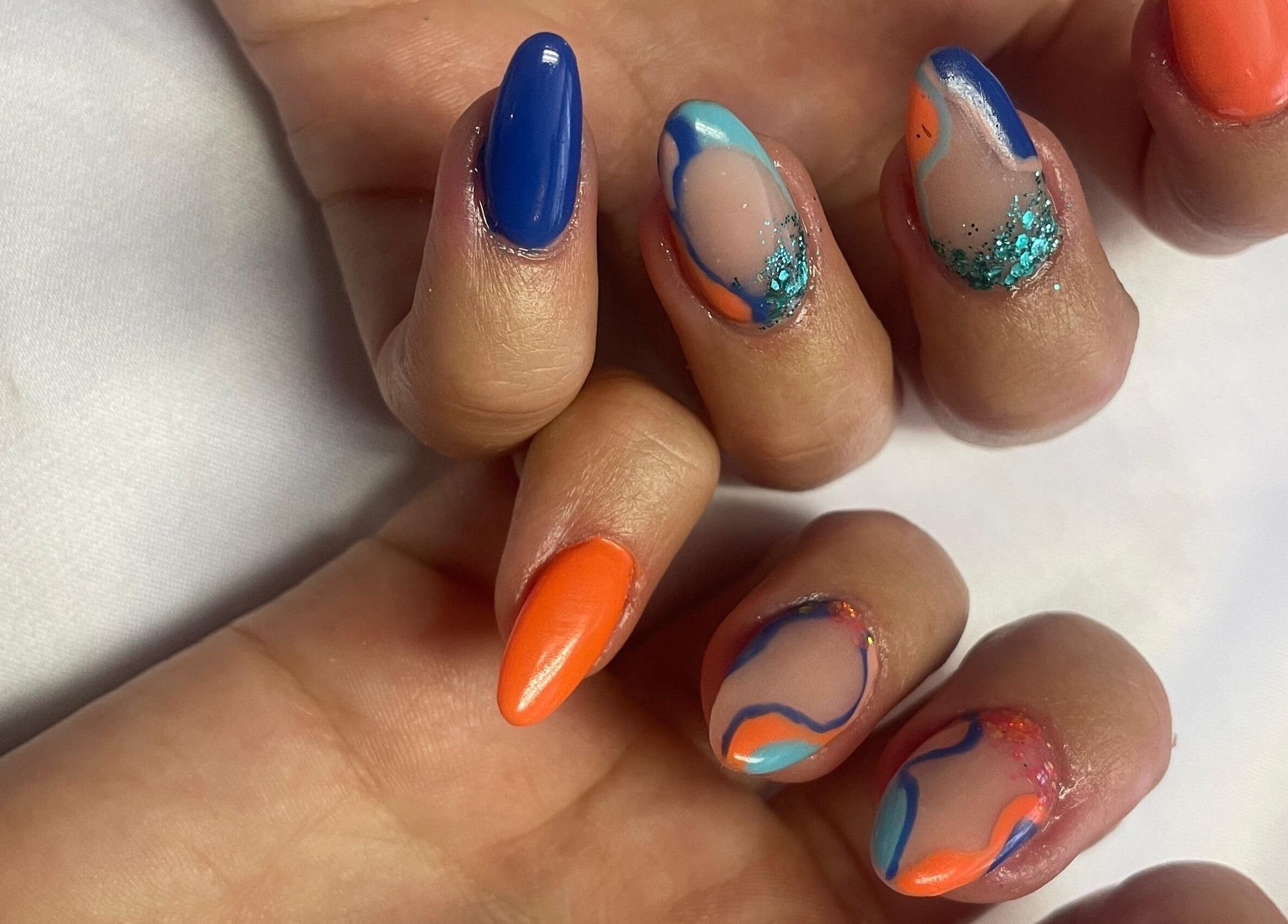 Colorful swirl nail art by Cat's Claw Nails, Pretoria, Gauteng, ZA. Bright blue and orange hues.