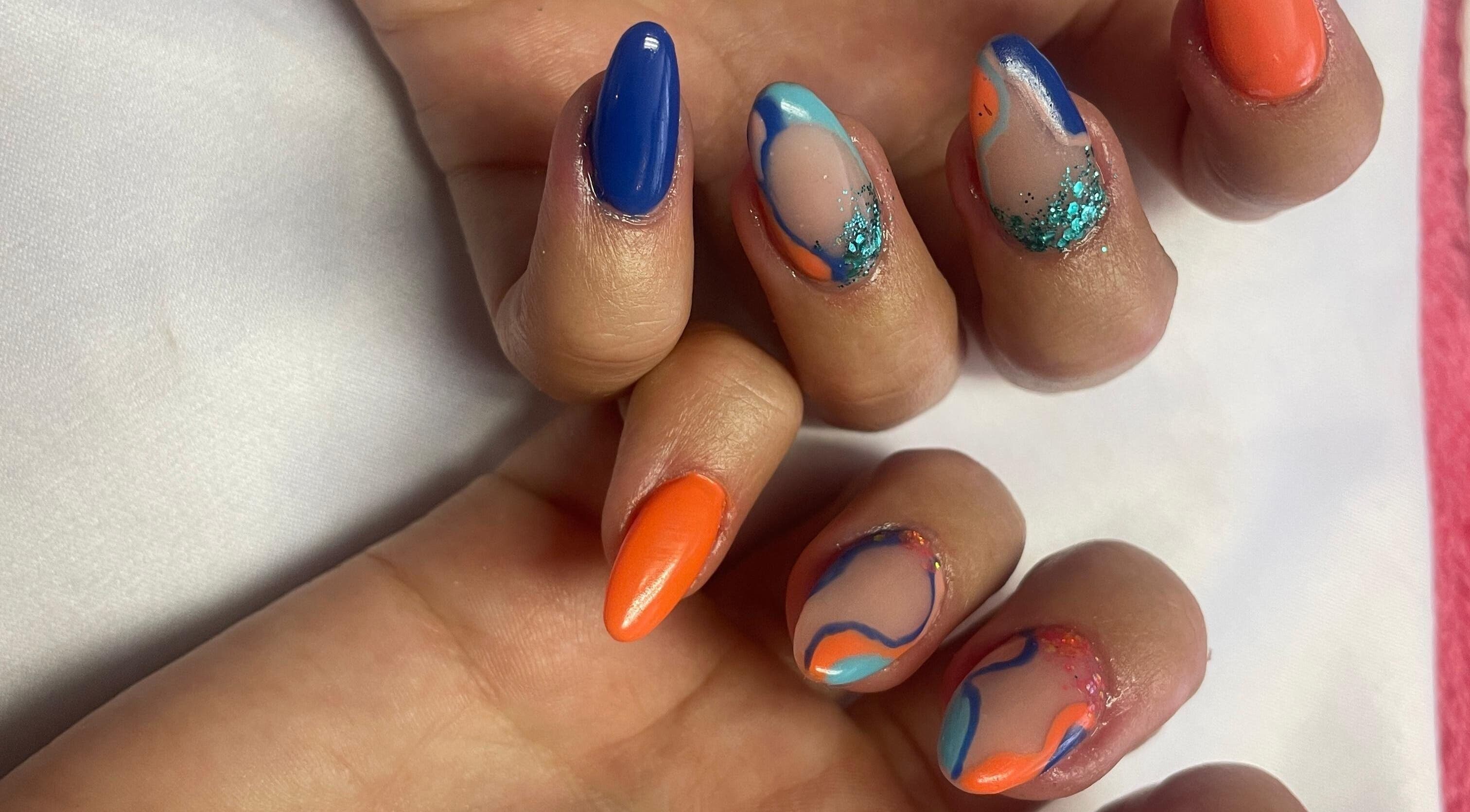 Colorful swirl nail art by Cat's Claw Nails, Pretoria, Gauteng, ZA. Bright blue and orange hues.