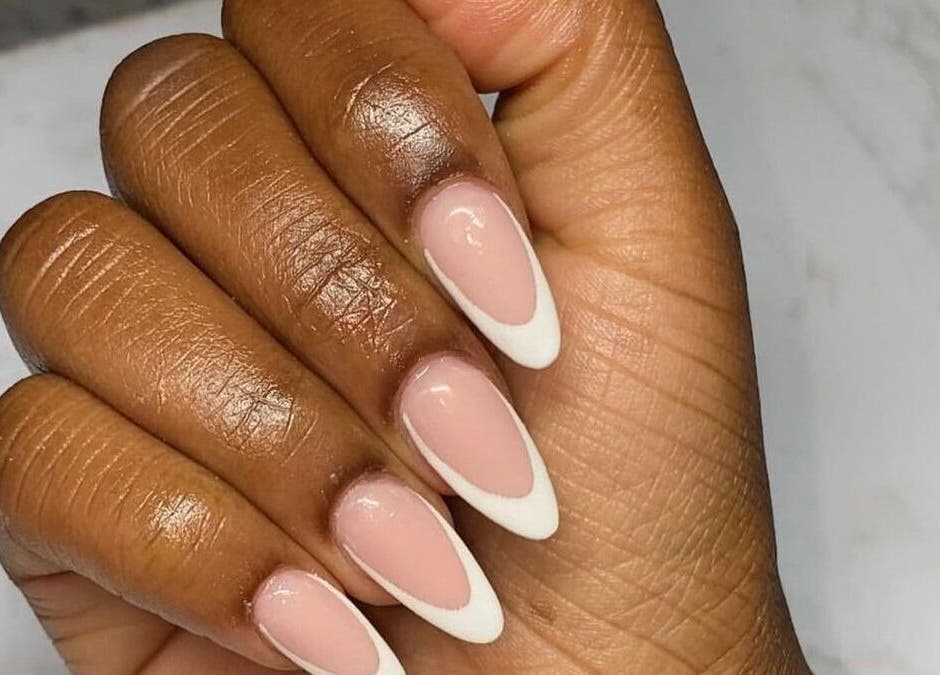 Stylish French manicure at Cat's Claw Nails, Pretoria, Gauteng, ZA showcasing elegant white tips.