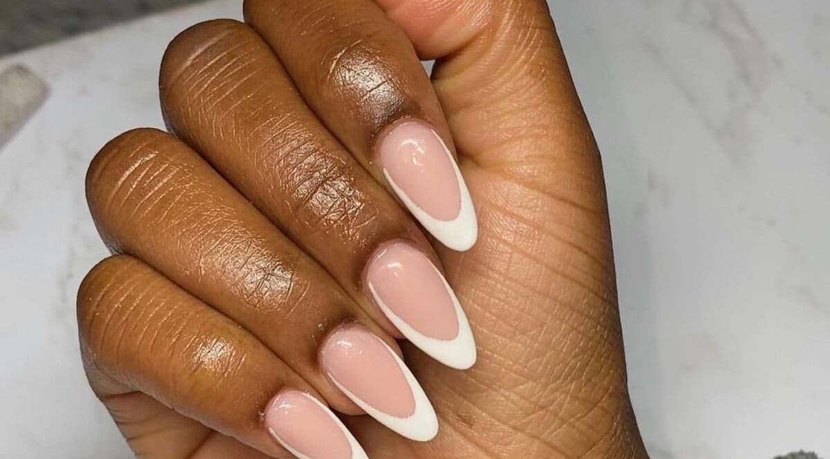 Stylish French manicure at Cat's Claw Nails, Pretoria, Gauteng, ZA showcasing elegant white tips.