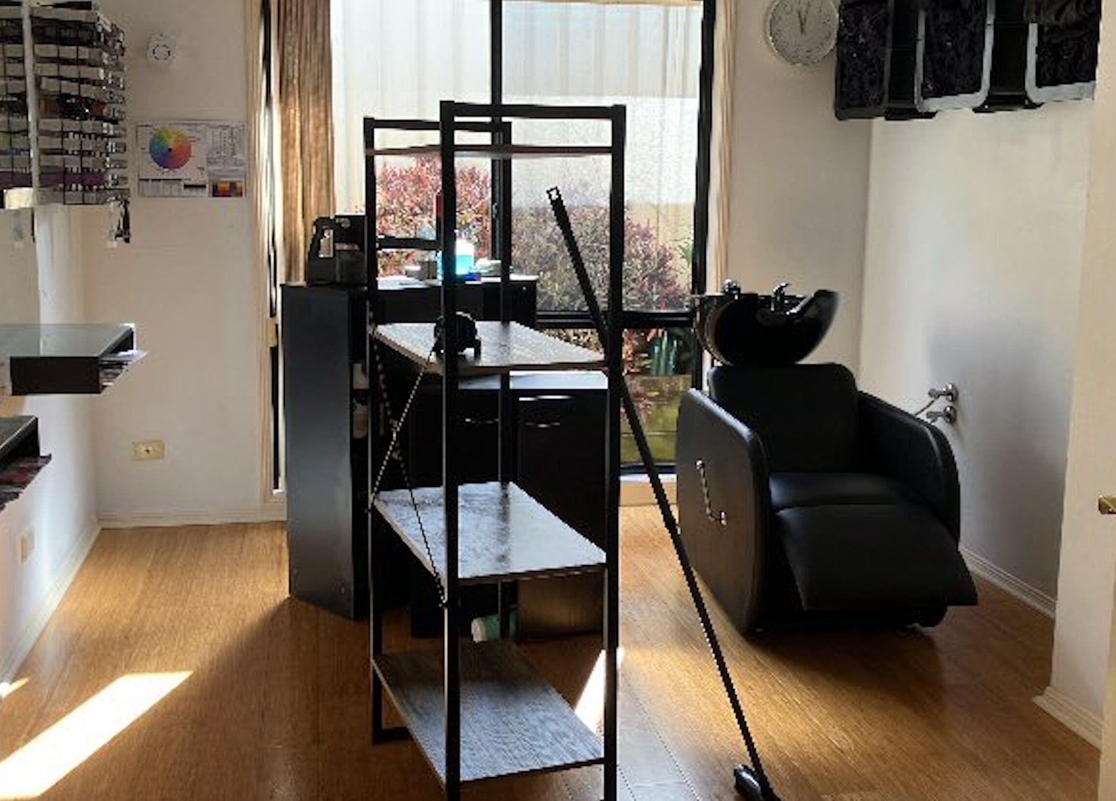 Modern salon setup at Sammy Hair, Thornton, New South Wales, AU with sleek styling stations and comfortable chairs.