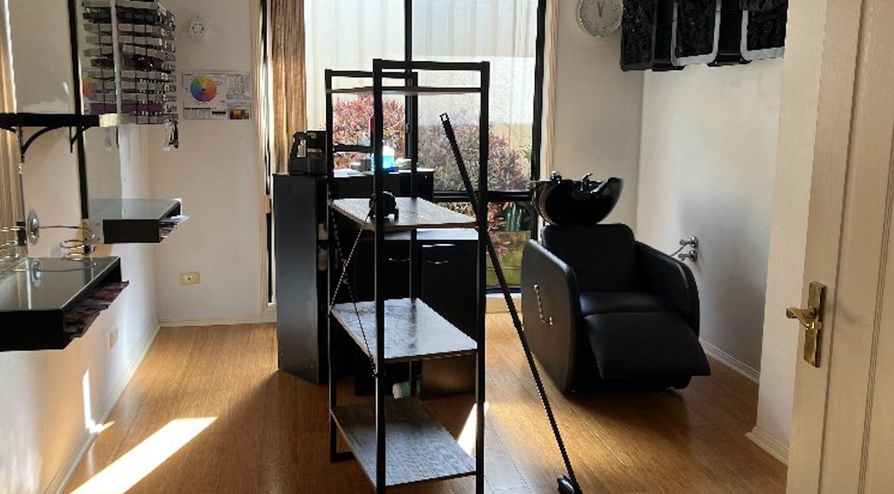 Modern salon setup at Sammy Hair, Thornton, New South Wales, AU with sleek styling stations and comfortable chairs.