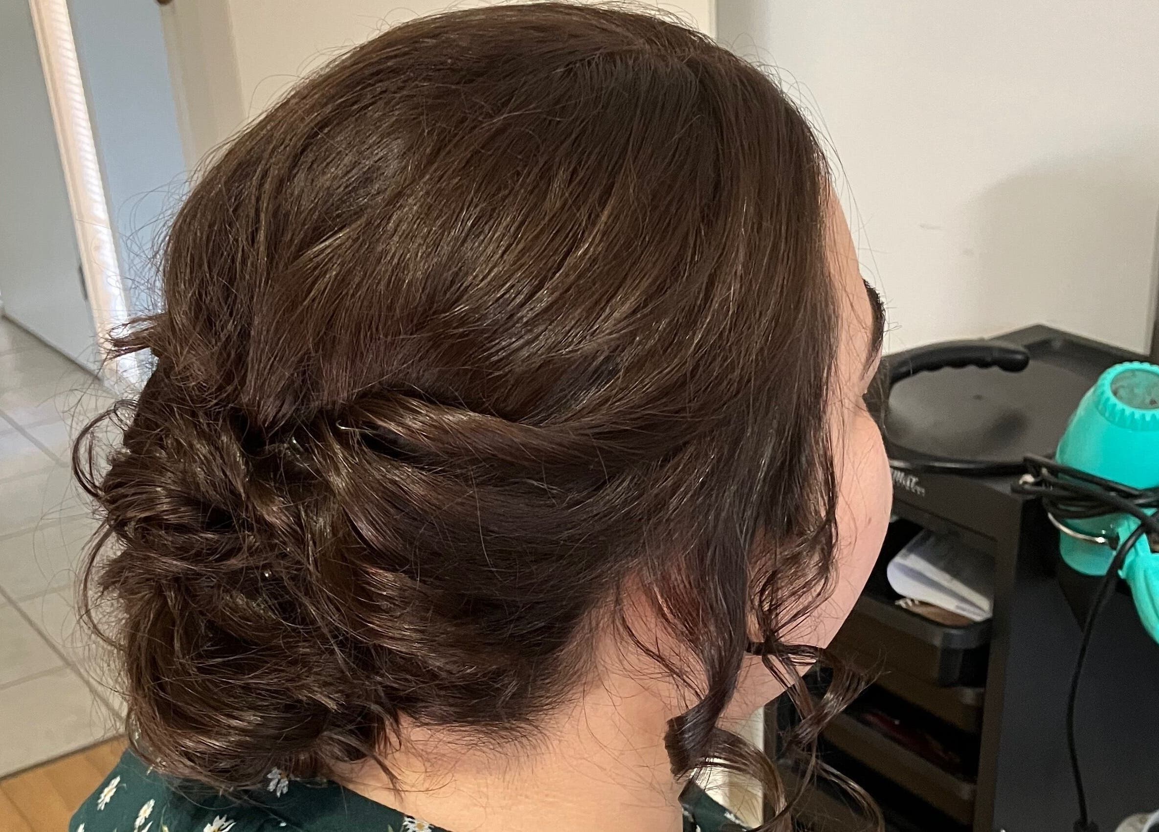 Elegant hairstyle at Sammy Hair, Thornton, New South Wales, AU showcasing a chic updo.