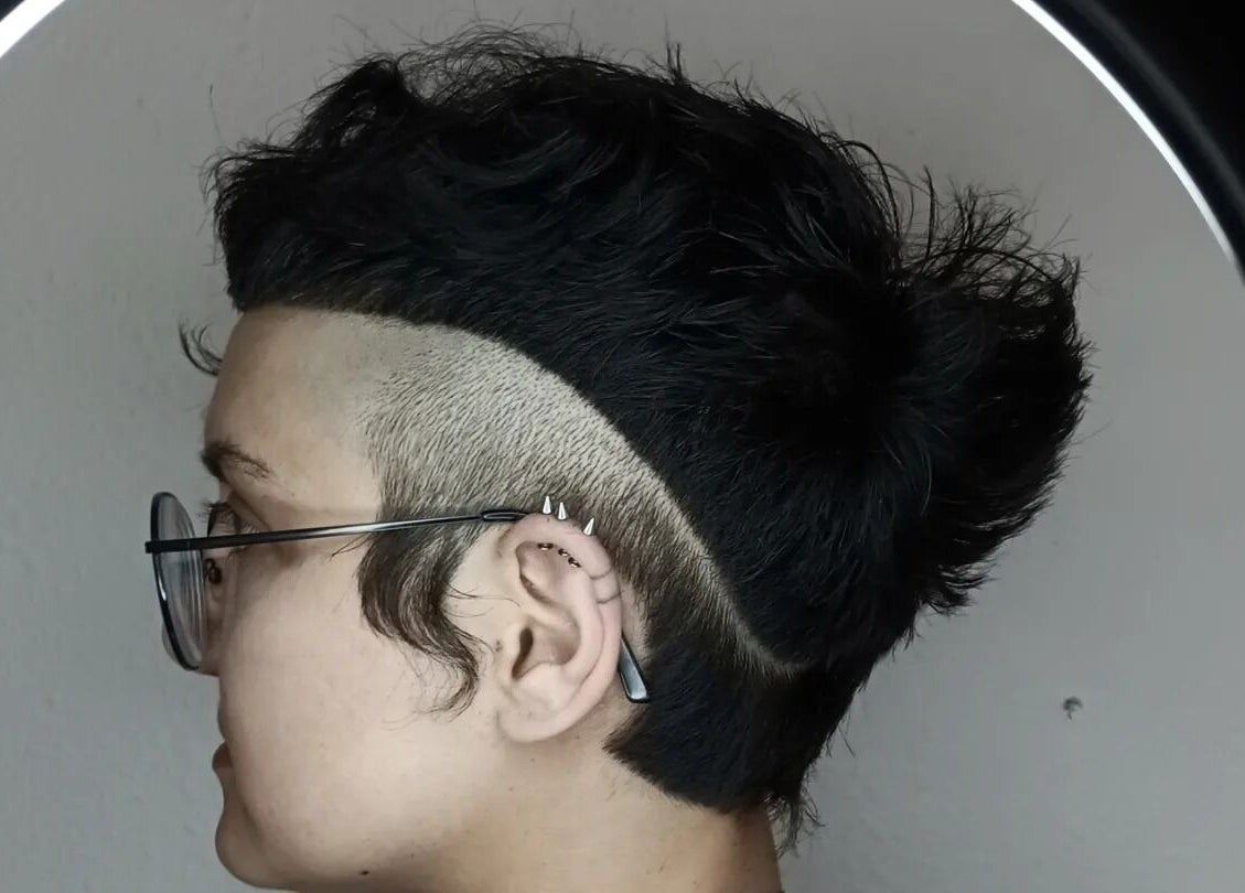 Close-up of a trendy undercut hairstyle at Mercuri Experience, Berlin, Berlin, DE, showcasing modern hair art.