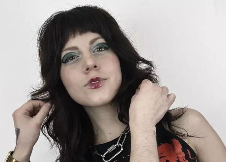 Stylish woman showcasing bold makeup at Mercuri Experience, Berlin, Berlin, DE.