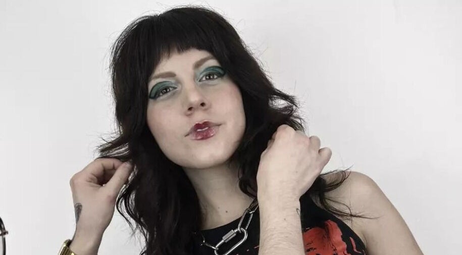 Stylish woman showcasing bold makeup at Mercuri Experience, Berlin, Berlin, DE.