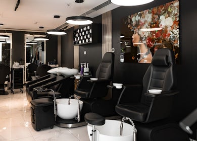 Interior of Barbero Gentlemen's Lounge in Dubai, AE showcasing sleek seating and modern decor.