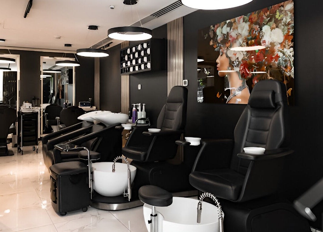 Interior of Barbero Gentlemen's Lounge in Dubai, AE showcasing sleek seating and modern decor.