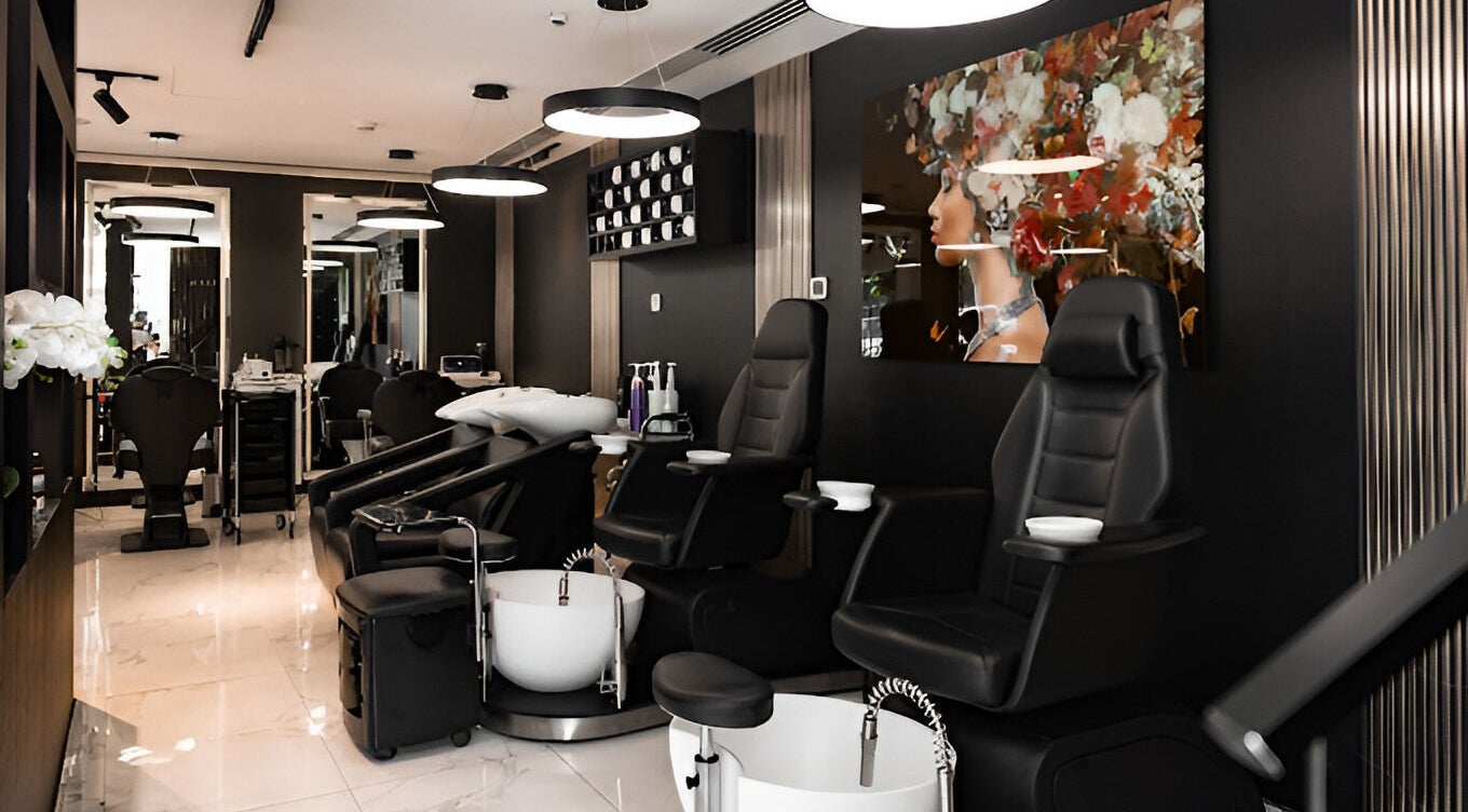 Interior of Barbero Gentlemen's Lounge in Dubai, AE showcasing sleek seating and modern decor.