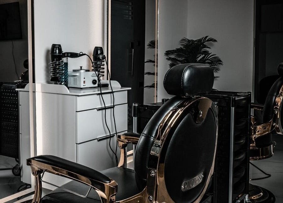 Sleek barber chair at Barbero Gentlemen's Lounge, Dubai, AE showcasing premium grooming setup.