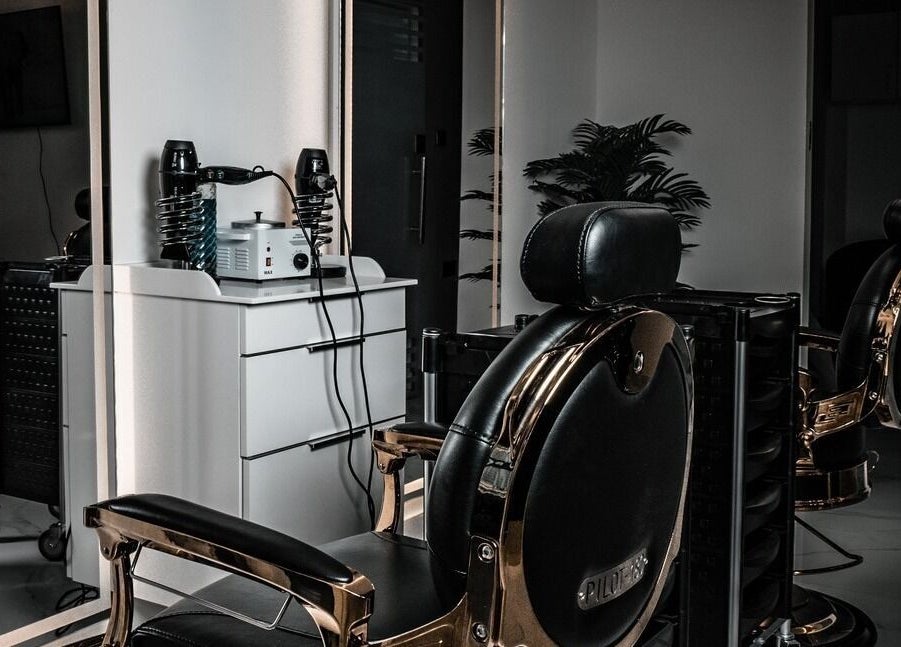 Sleek barber chair at Barbero Gentlemen's Lounge, Dubai, AE showcasing premium grooming setup.