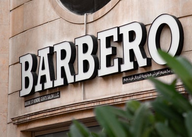 Signage of Barbero Gentlemen's Lounge in Dubai, AE displayed on a stylish exterior wall.