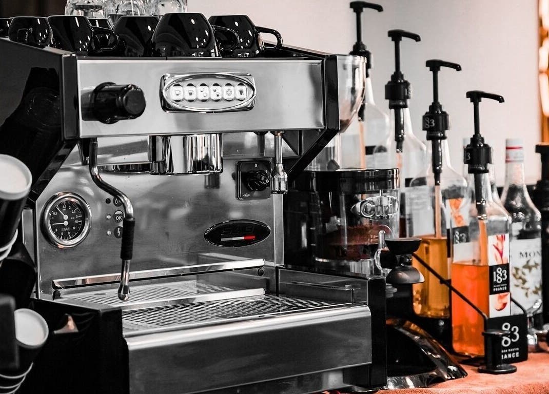 Espresso machine at Barbero Gentlemen's Lounge, Dubai, AE showcasing premium coffee setup.