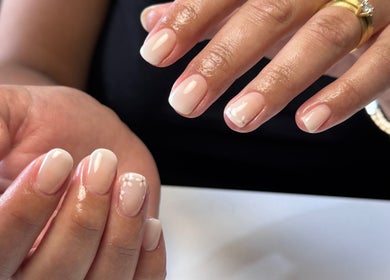 Close-up of polished nails with floral design at Polished by Victoria, Redruth, England, GB.