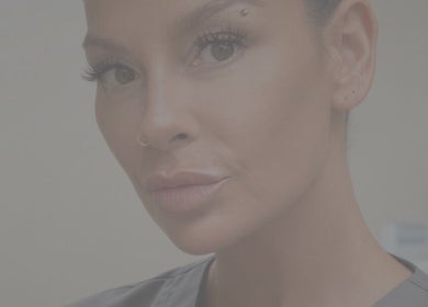Close-up of a professional at KAaesthetics, Byfleet, England, GB showcasing a radiant complexion.